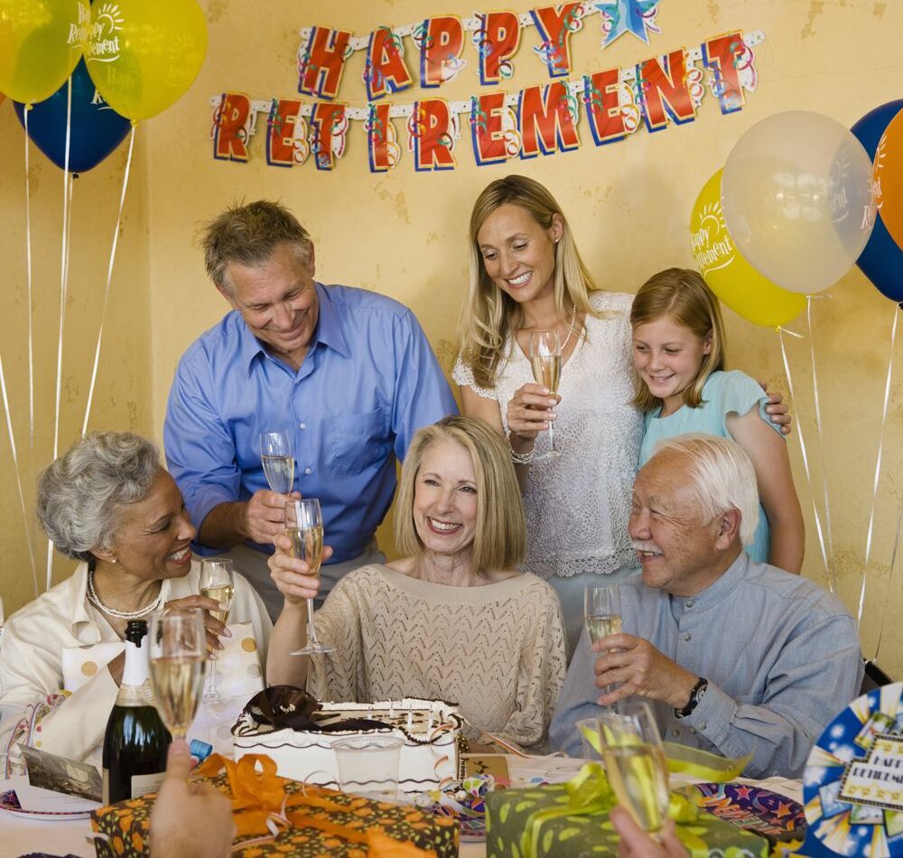 Smiling crowd at a retirement party
